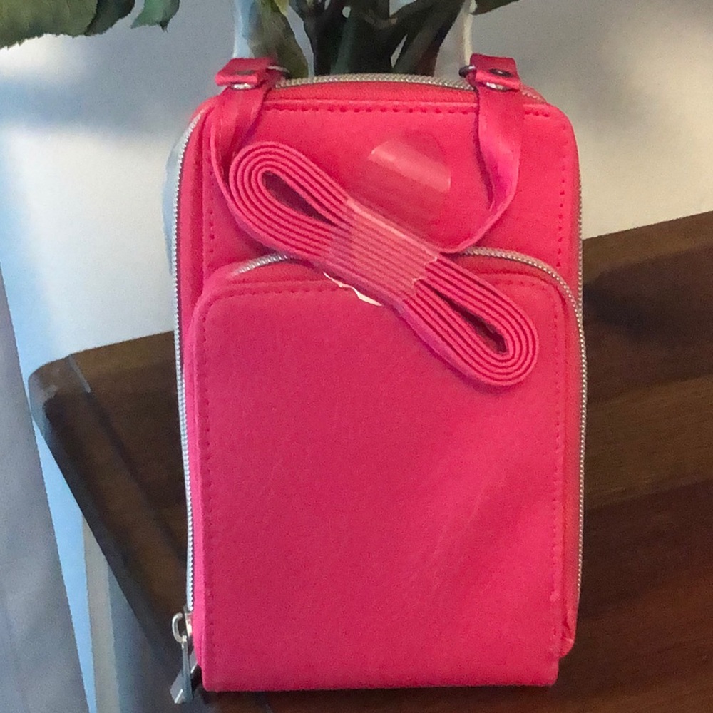 This is a cute hot pink crossbody purse!